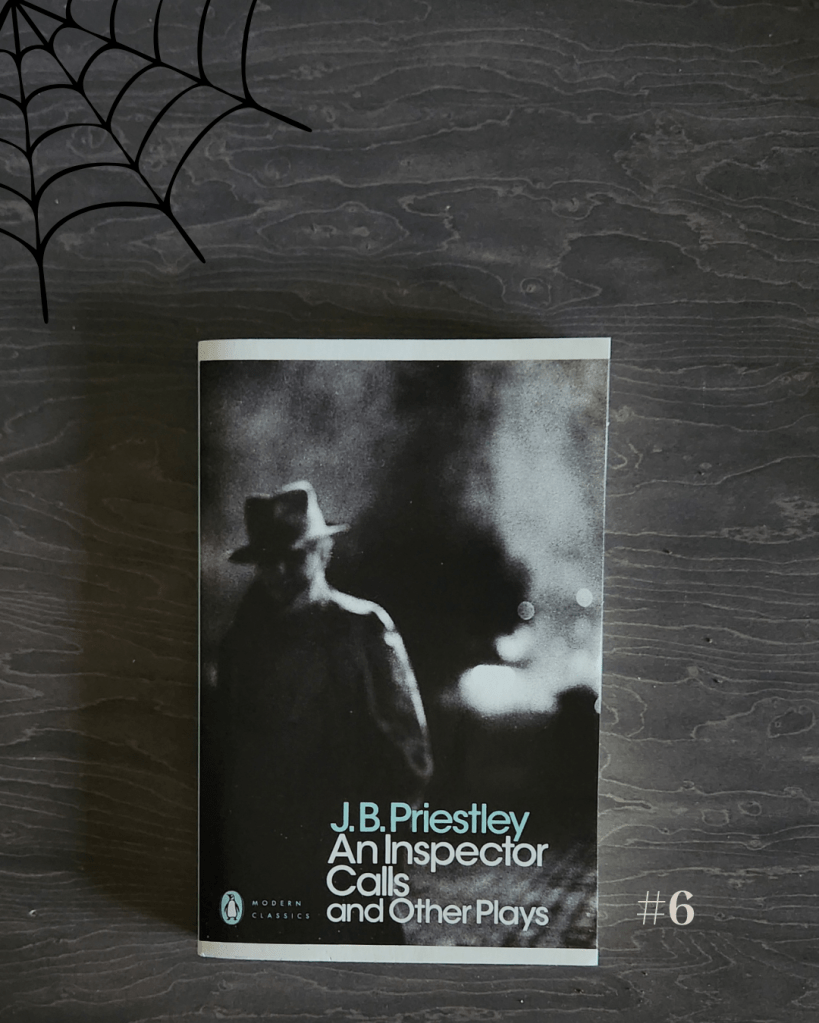 A flat lay of An Inspector Calls and Other Plays by J. B. Priestley, part of the Penguin Modern Classics series. The book cover features a shadowy, black-and-white photograph of a man in a fedora and overcoat, seen from behind and surrounded by mist or smoke, evoking a noir and mysterious mood. The book rests on a dark wood surface with a black spider web graphic in the upper left corner and the number “#6” in light gray at the bottom right, continuing the spooky, Halloween-inspired theme.